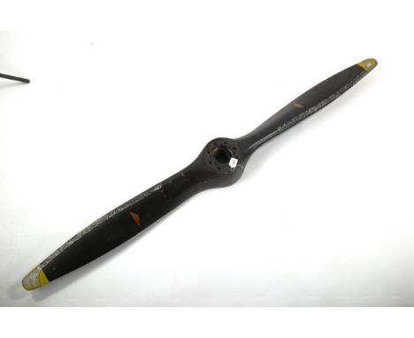 A Vintage laminate wood aircraft propeller, by G Merville, with aluminium edges, length 198cmPaint generally chipped, metal e