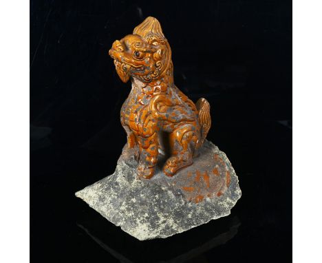 A Chinese Tang Dynasty yellow glaze pottery lion roof tile, height 33cm 