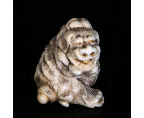 A Japanese carved ivory netsuke in the form of a dragon, Meiji Period, height 3.5cmGood condition 