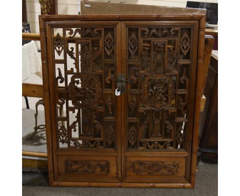 A Chinese elm cedar and Huang-Yang wood window panel, Zhejiang Province South East China, early 19th century, the 2 hinged do
