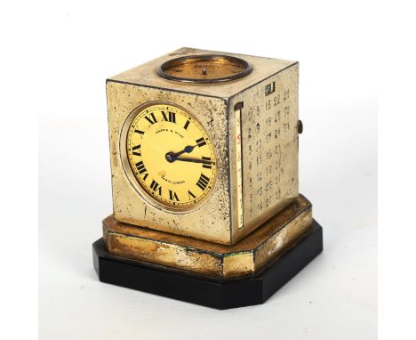 An Art Deco Mappin & Webb revolving cube-shaped combination desk compendium, comprising clock, calendar, compass and baromete