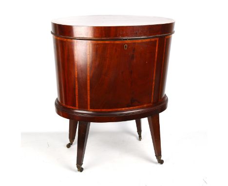 An Edwardian mahogany and satinwood crossbanded oval wine cooler, on tapered legs, length 53cm, depth 38cm, height 66cmGood c