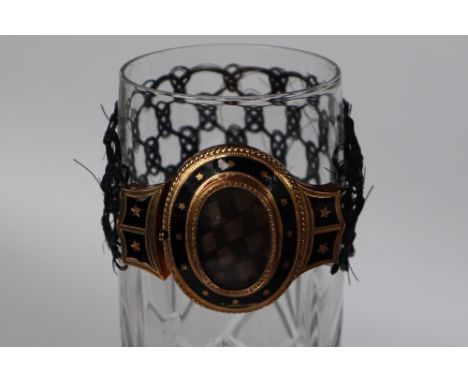 A Victorian mourning bracelet, the yellow metal top of oval form with plaited hair, black enamel bands and stars on a hair br