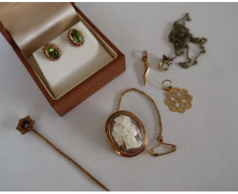 A pair of Clogau 9ct gold peridot set earrings, together with a yellow metal mounted shell cameo brooch of a head in profile,