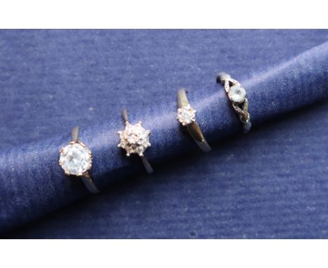 A diamond cluster ring set with nine round brilliant cut diamonds, to a white metal setting and 9ct gold shank, size L, toget