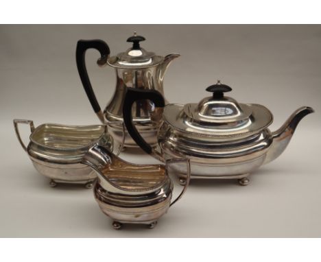 A George VI silver four piece tea set, comprising a teapot, hot water pot, cream jug and sugar basin, Chester, 1931, S Blanck