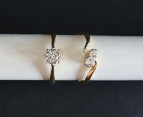 A solitaire diamond ring, set with around faceted diamond to an 18ct gold shank, size P together with a two stone diamond rin