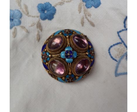 A silver gilt wirework brooch set with four cabochon amethysts and enamel decoration of flowers and leaves, 38mm diameter