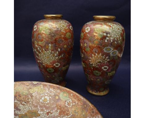A Japanese Satsuma pottery plate profusely painted with flowers and leaves, seal mark and flowers to the reverse, 24cm diamet
