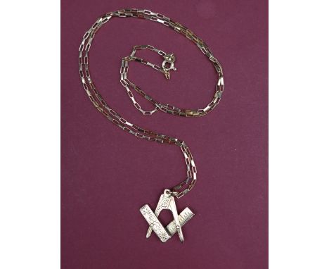 A 9ct gold pendant in the form of a large masonic square and compass, on a 9ct gold chain overall approximately 5 grams