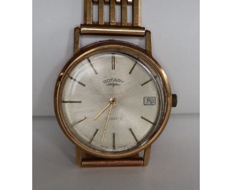 A Gentleman's 9ct yellow gold Rotary wristwatch, the circular dial with batons and date aperture on a 9ct gold strap overall 