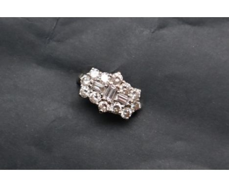 A diamond cluster ring, set with baguette and round brilliant cut diamonds to an 18ct white gold setting and shank,  size K, 