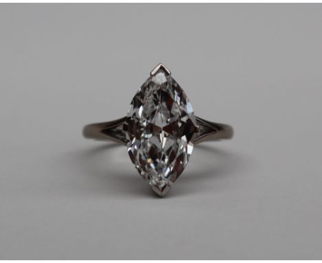 A 3.53 carats marquise cut solitaire diamond ring, 14.86mm x 8.63mm x 4.50mm deep to a white metal setting and shank, size M,