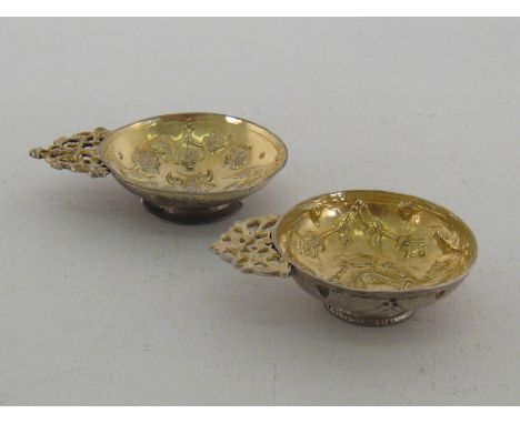 Two Russian parcel-gilt silver charki, one with untraced mark, apparently a Slavonic year mark (?) being initials LV in old a