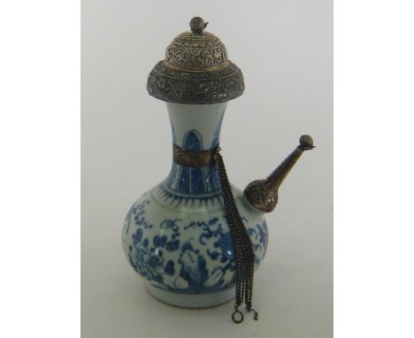 A Chinese blue and white ceramic hookah, probably early 19th century with Indian parcel-gilt silver mounts chased with flower