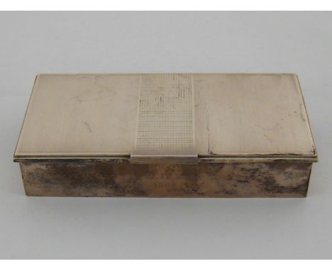 A silver cigarette box with engine turned lid and plain sides, initialled front. 19.5x9.5x4cm. gross wt. 586gm.  CONDITION RE