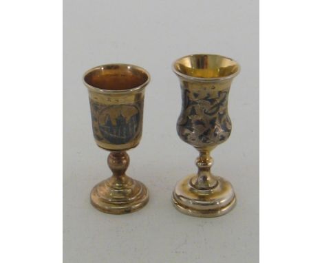 Two Russian silver-gilt and niello goblets, one by Pyotr Loskutov, Moscow, 1853, with foliate decoration, the other by Andrei