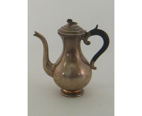 A late 19th. century Dutch silver, 833 assay, baluster coffee pot  with duck beak spout and flower finial. Ht. 17cm, wt. 255g