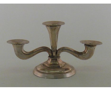 An Austrian 900 standard silver three-light candelabrum, maker's mark SR in oval, pre-1922, with faceted branches on hexagona