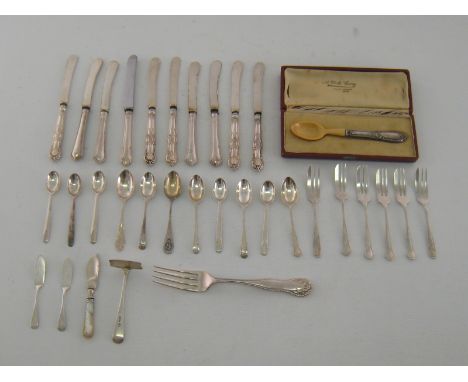 A mixed silver and silver plate group of English flatware comprising:- 5 Queens pattern butter knives, 5 others, 4 pastry for