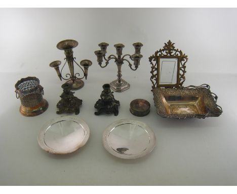 A mixed group of plated items comprising:- a pair of tazze by Mappin & Webb, a French circular box, a swing-handled basket, a