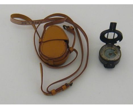 A WWII military prismatic marching compass Mk. III, 1940, No. B85962. by T.G. Co. Ltd., in leather shoulder case. 