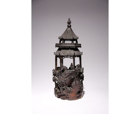 A CHINESE CARVED BAMBOO MODEL OF A PAGODA LATE QING DYNASTY With trees rising from rocks and with a multitude of small figure