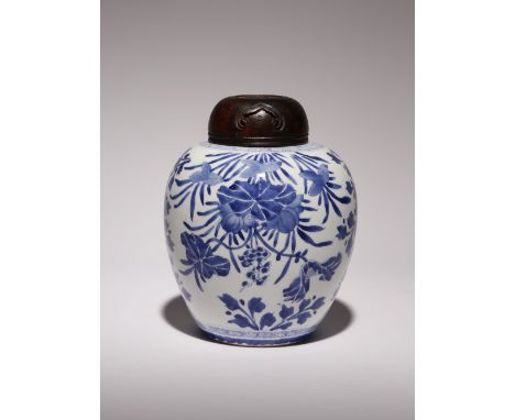 A CHINESE BLUE AND WHITE OVOID VASE KANGXI 1662-1722 Painted with lotus and peony between geometric bands, the base with a ri