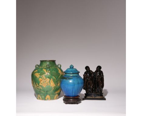 THREE CHINESE CERAMIC ITEMS MING DYNASTY Comprising: a treacle glazed figural flask with a wood stand, a turquoise glazed jar