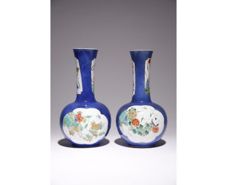 A NEAR PAIR OF CHINESE POWDER-BLUE GROUND BOTTLE VASES KANGXI 1662-1722 Each with a globular body and a slightly flaring neck