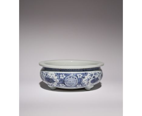 A CHINESE BLUE AND WHITE TRIPOD INCENSE BURNER 17TH CENTURY The compressed circular body painted with panels of egrets amidst