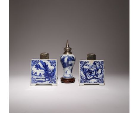 A NEAR PAIR OF CHINESE BLUE AND WHITE RECTANGULAR FLASKS KANGXI 1662-1722 Each painted with panels of figures in landscapes, 