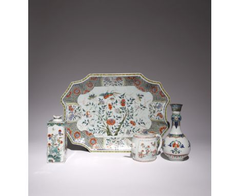 FOUR CHINESE FAMILLE VERTE ITEMS KANGXI 1662-1722 Comprising: a rectangular bottle painted with panels of flowers, rockwork a