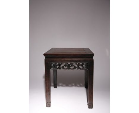 A CHINESE HARDWOOD LOW TABLE LATE QING DYNASTY The square panel top above a pierced frieze, raised on square-section legs wit