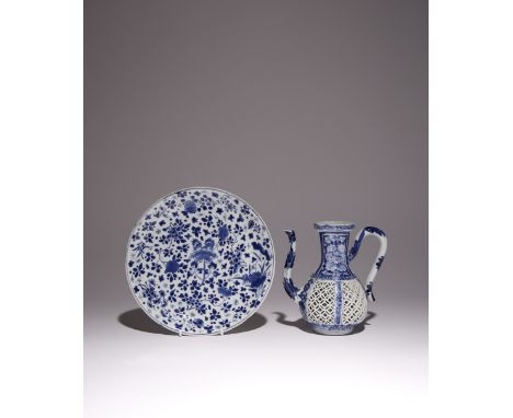 A CHINESE BLUE AND WHITE EWER AND A PLATE KANGXI 1662-1722 The ewer with a reticulated body and a pierced cash symbol to the 