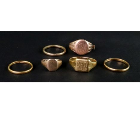 Six various gold rings, comprising, two 22ct gold wedding bands, 4.3g; an 18ct gold square signet ring engraved with a monogr