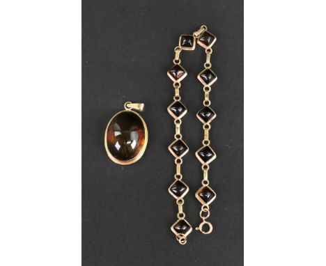 A modern Baltic amber bracelet of 11 lozenge shaped links each rub-over set with a square cabochon amber, on a bolt-ring clas