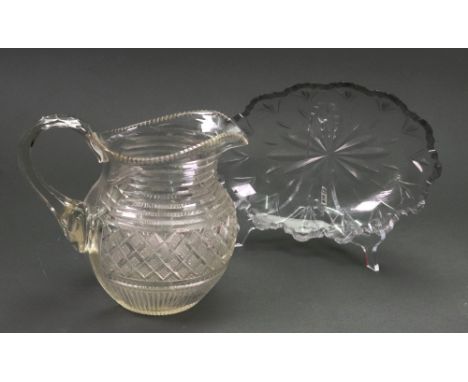 A Regency style baluster shape glass water jug, late 19th/early 20th century, with step - cut neck above a band of diamond cu