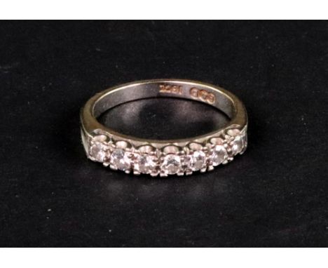 A Boodle and Dunthorne diamond half-eternity ring, the seven round brilliants approximately 0.50cts total, claw set in white 