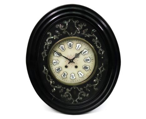 A French wall timepiece, circa 1870, the hexagonal ebonised case with a hinged moulded oval glazed front with an inner band d
