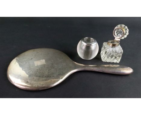 A silver mounted glass match holder/striker, London 1921, a silver mounted hand mirror, Chester 1913, engraved with ribbon ti