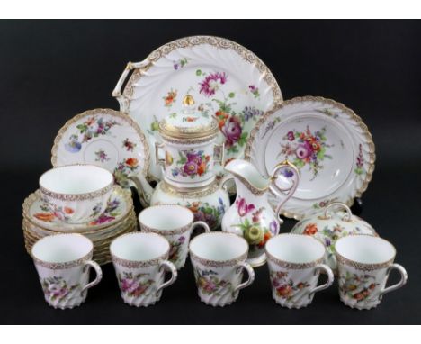 A collection of Dresden and other German porcelain painted with flowers including: a teapot, milk jug, muffin dish, tea cups,