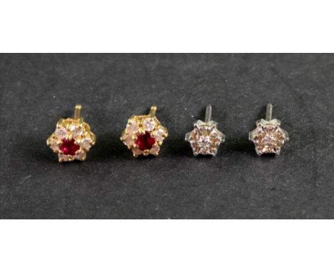 Two pairs of 18ct gold and gem set stud earrings, comprising; a pair of yellow gold, ruby and diamond seven stone cluster stu