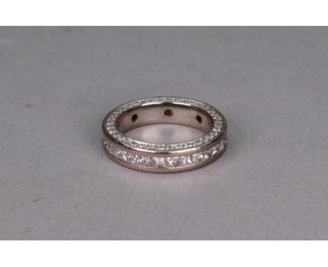 An 18ct white gold full eternity ring, channel set with princess cut diamonds, diamonds approximately 0.06ct each, with round