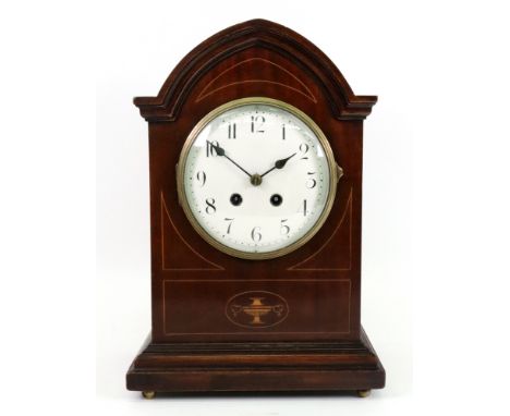 An Edwardian mahogany boxwood strung 'Sheraton Revival' mantel clock, with arched top case, enamel dial with Arabic numerals 