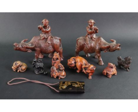 A collection of seven Japanese carved wood netsuke, 20th century, to include a frog on a tortoise, a monkey on a horse, a dog