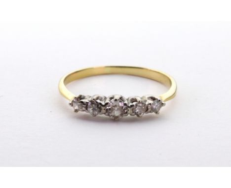 A graduated five-stone brilliant-cut diamond ring, claw-set in white on a yellow metal shank, size S, 2.3g gross.