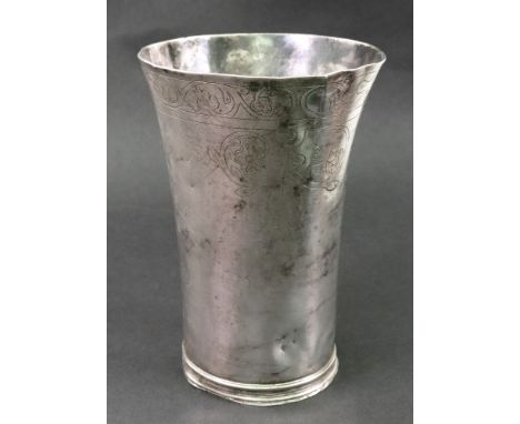 An Elizabeth I silver beaker, London 1583, maker's mark I N in monogram, of tapering cylindrical form on a threaded foot, eng