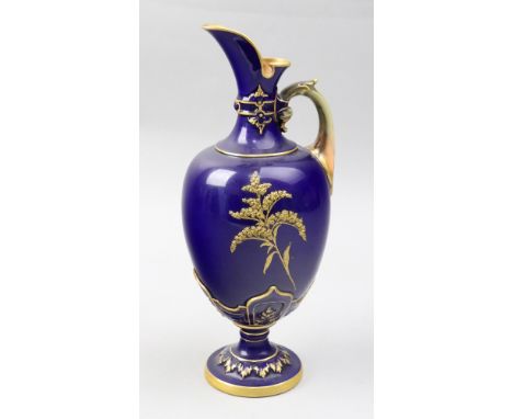A Royal Worcester bone china ewer, circa 1895, the ovoid body gilt and tooled in high relief with branches against a deep blu