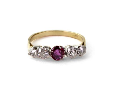 A five-stone ruby and diamond ring, the central oval mixed-cut ruby between two pairs of old-cut diamonds, claw-set in white 